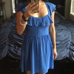 Blue flowy dress with buttons and ruffled neckline
